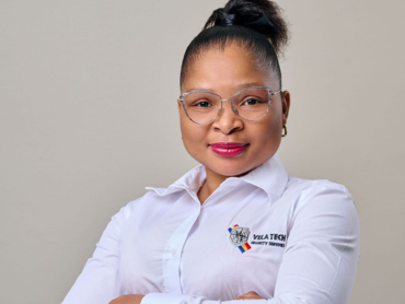 A Vela-Tech Security head office staff member in uniform